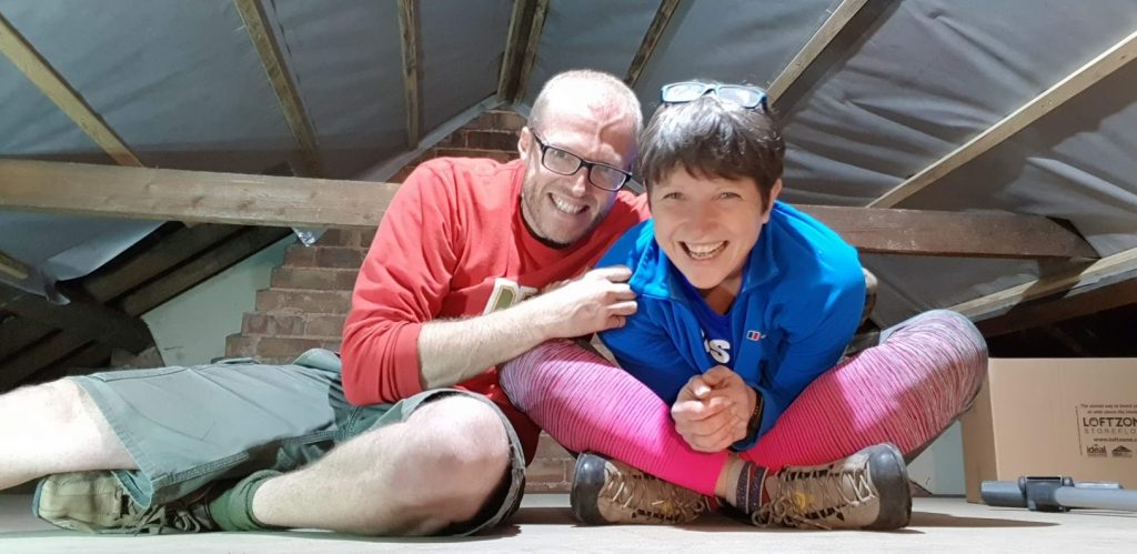 two people sitting in their boarded loft