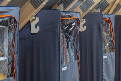 multiple smart loft wardrobes hanging from beams